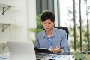 Remote Work and Communication. Young professional discussing documents on a call. photo