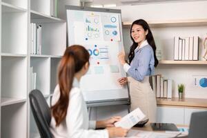 Business Presentation and Team Collaboration. A woman explaining data insights at a meeting. photo