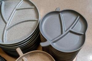 Stacked Ceramic Plates with Leaf Patterns photo