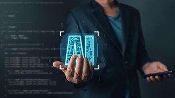 professional showcases a glowing AI icon, symbolizing artificial intelligence, innovation, and data-driven technology, emphasizing progress, modern solutions, and the future of digital transformation. photo