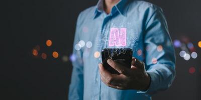 A person holds a smartphone with AI intelligence displayed as a glowing hologram, symbolizing advanced computer technology, machine learning, and innovation in modern digital systems. photo