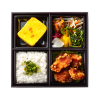 A visually appealing and neatly organized Japanese style bento box featuring a balanced selection of savory and colorful dishes including fried chicken white rice and fresh vegetables png