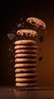 Delicious Chocolate Chip Cookies Stacked High with Falling Treats photo