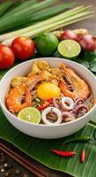 Delicious Seafood Noodle Soup with Shrimp and Egg Yolk photo