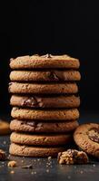 Delicious Chocolate Chip Cookies Stacked High on Dark Background photo