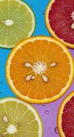 Citrus Slices of Orange and Lemon with Seeds and Juice on Colorful Background photo