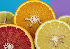Colorful Display of Orange and Lemon Fruit Halves with Visible Juiciness photo