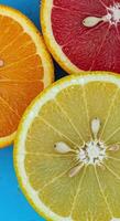 Cross-Sectional Orange and Lemon Slices with Juicy Droplets on Vibrant Backdrop photo