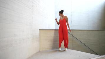 An Elegant Dance Performance Set Amidst a Striking Modern Architectural Space Design video