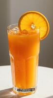 Refreshing Iced Orange Juice Drink in Glass with Orange Slice Garnish photo