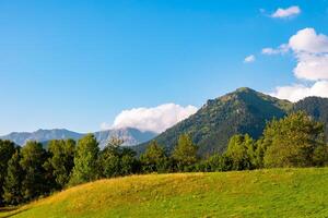 Landscape of the rural area. Rolling clouds over the mountains photo