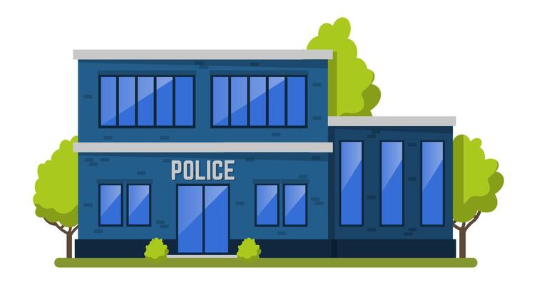Police station building with glass windows and doors, located in a green area with trees and bushes, providing security and law enforcement services to the community