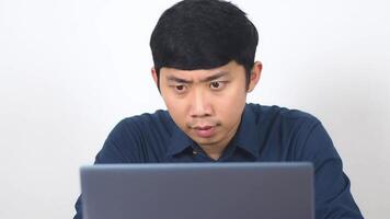 Man checking laptop and feels happy about success slow motion video