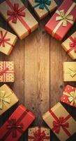 Many presents on a wooden table with a circle of ribbon photo
