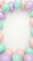 Pastel colored balloons on white background photo