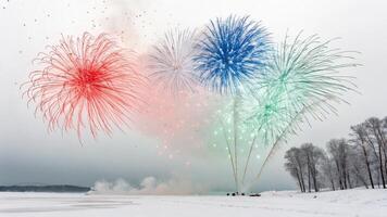 Winter Fireworks Display Over Frozen Lake with Snowy Landscape and Bare Trees in Background photo