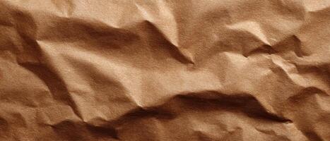 Closeup of crumpled brown paper texture natural light abstract design studio setting photo