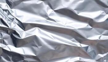 Wrinkled aluminum foil texture reflecting light close-up photography studio abstract photo