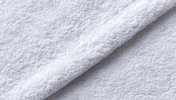 Soft white towel texture bathed in natural sunlight closeup photography indoor setting photo
