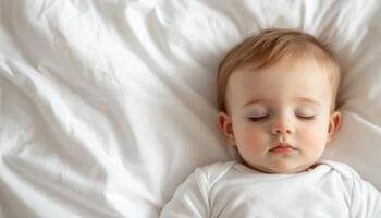 Peaceful baby sleeping on soft white sheets in sunlit room calm and cozy atmosphere photo
