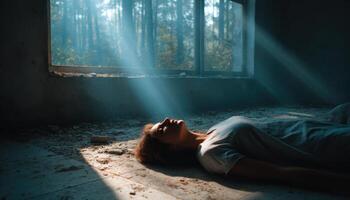 Ethereal light falling on person laying on floor in abandoned room mystical atmosphere photo