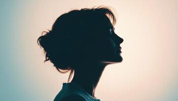 Moody backlight portrait of a beautiful woman studio photography artistic profile view photo