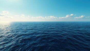 Cargo ship navigating vast ocean under bright sunlight maritime scene serene environment photo