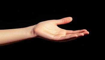 Artistic closeup of hand with subtle shadows studio photography black background photo