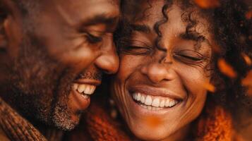Happy Couple Embracing in Autumn Leaves photo