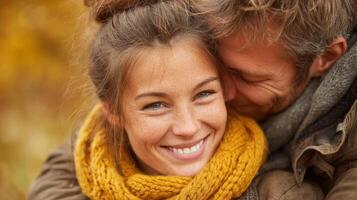 Happy Couple Embracing in Autumn Snow photo