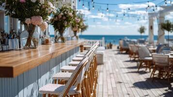 Beachfront Bar with Ocean View and Floral Decor photo