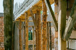 A view of the inside of a building with wooden beams photo