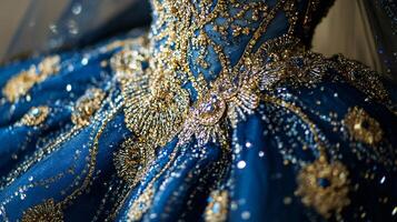 Elegant Regal Fashion Statement Featuring Intricate Blue and Gold Gown photo