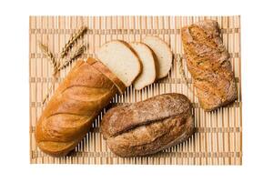Freshly baked bread slices napkin against isolated on white background. top view Sliced bread photo