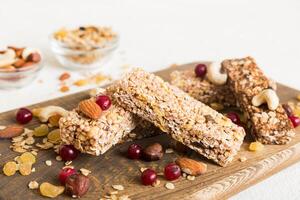 Various granola bars table background. Cereal granola bars. Superfood breakfast bars with oats, nuts photo