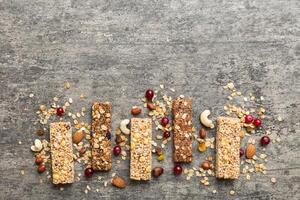 Various granola bars table background. Cereal granola bars. Superfood breakfast bars with oats photo