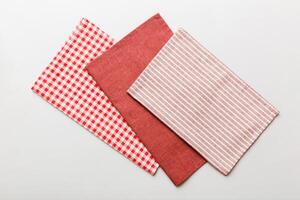 top view red empty kitchen napkin isolated table background. Folded cloth for mockup photo