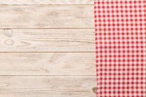 top view with red empty kitchen napkin isolated on table background. Folded cloth photo