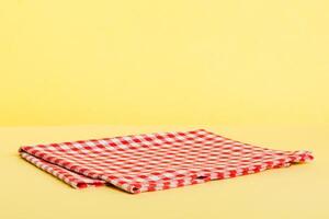 top view red empty kitchen napkin isolated on table background. Folded cloth for mockup with copy space. Minimal style photo