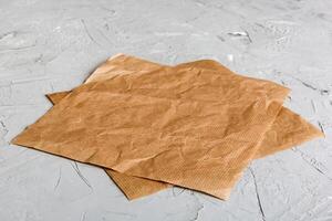 top view baking parchment empty on table background. Folded cloth for mockup with copy space, Flat lay. Minimal style photo