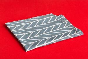 top view blue kitchen napkin isolated on table background. Folded cloth for mockup with copy space, Minimal style photo