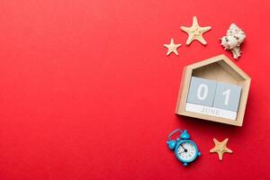 Image of june 1 wooden calendar on colored background. Summer day. Empty space photo