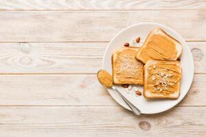 Peanut butter sandwiches toasts light table background.Breakfast. Vegetarian food photo