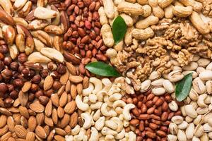 different nuts frame background. , top view, flat lay with vopy space. Walnut, pistachios, almonds, hazelnuts and cashews photo