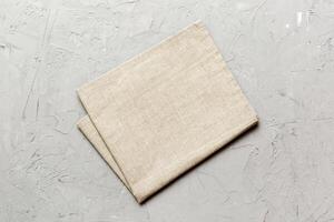 top view with gray kitchen napkin isolated table background. Folded cloth for mockup with copy space. Minimal style photo