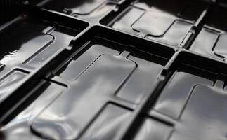 Glossy plastic surface with rectangular compartments photo