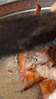 butcher a goose Close-up of slicing Chinese food Beijing roast duck for customers in restaurant video