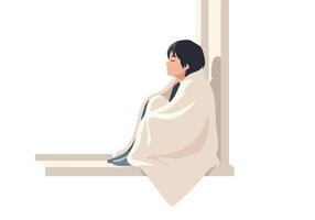 Person wrapped in blanket sitting near column vector