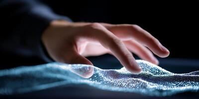 A person touching a screen with a wave pattern photo