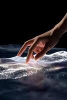 A hand touching a piece of fabric on a surface photo